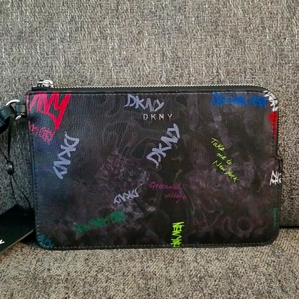 Nwt DKNY medium black graffiti wristlet. Retails $78